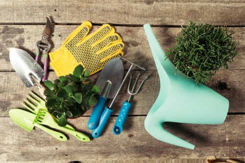 Gardening team arriving at a terraced house with tools for a front garden tidy